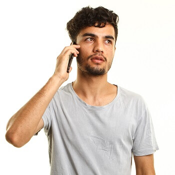 A young man talking on the phone
