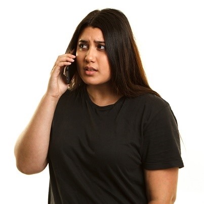 A young woman talking on the phone