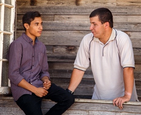 2 young men talking