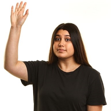 A girl raising her hand to say something
