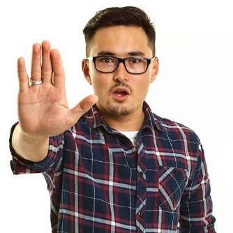 A man putting his hand up to say stop