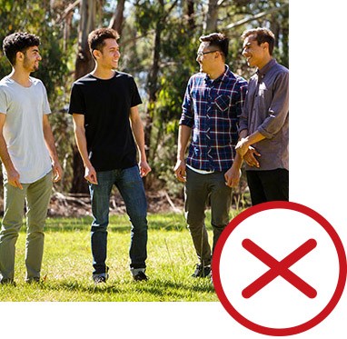 A group of friends standing together and talking and a cross next to the image