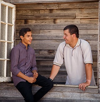 2 young men talking